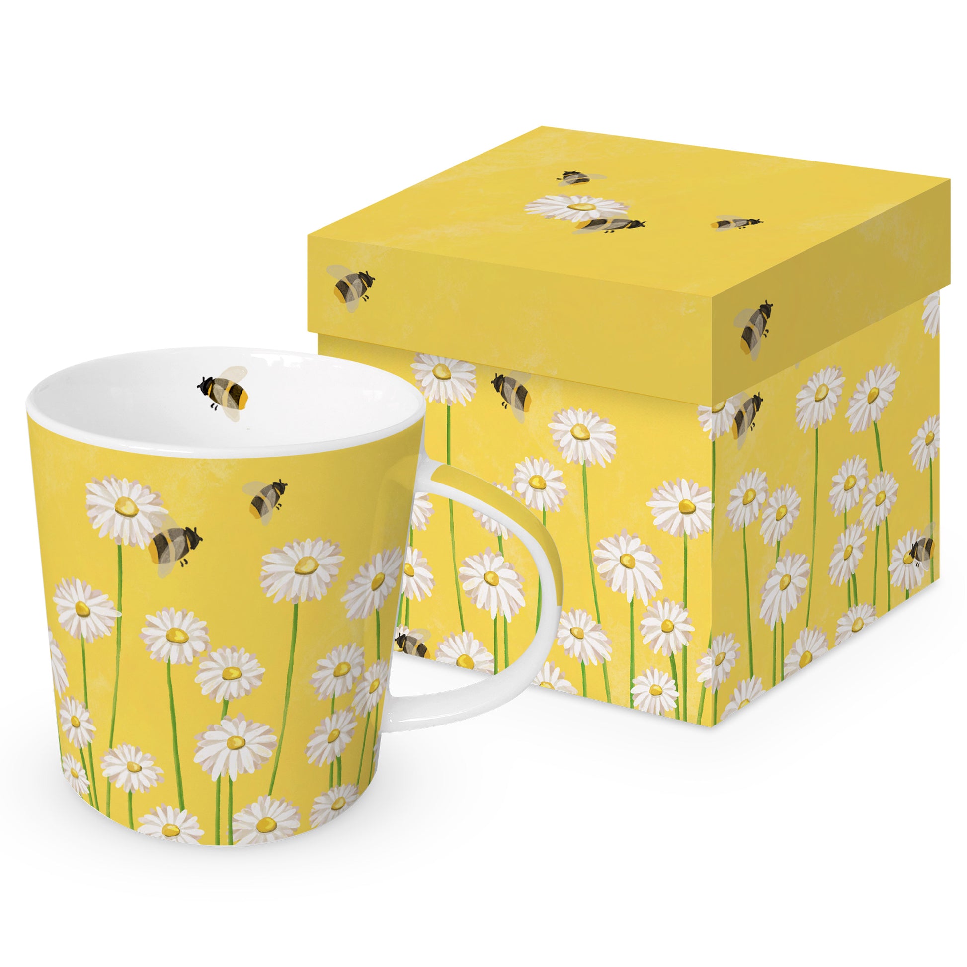 Eine Porzellantasse mit Bienen- und Gänseblümchenmotiv neben einer passenden Geschenkdose.