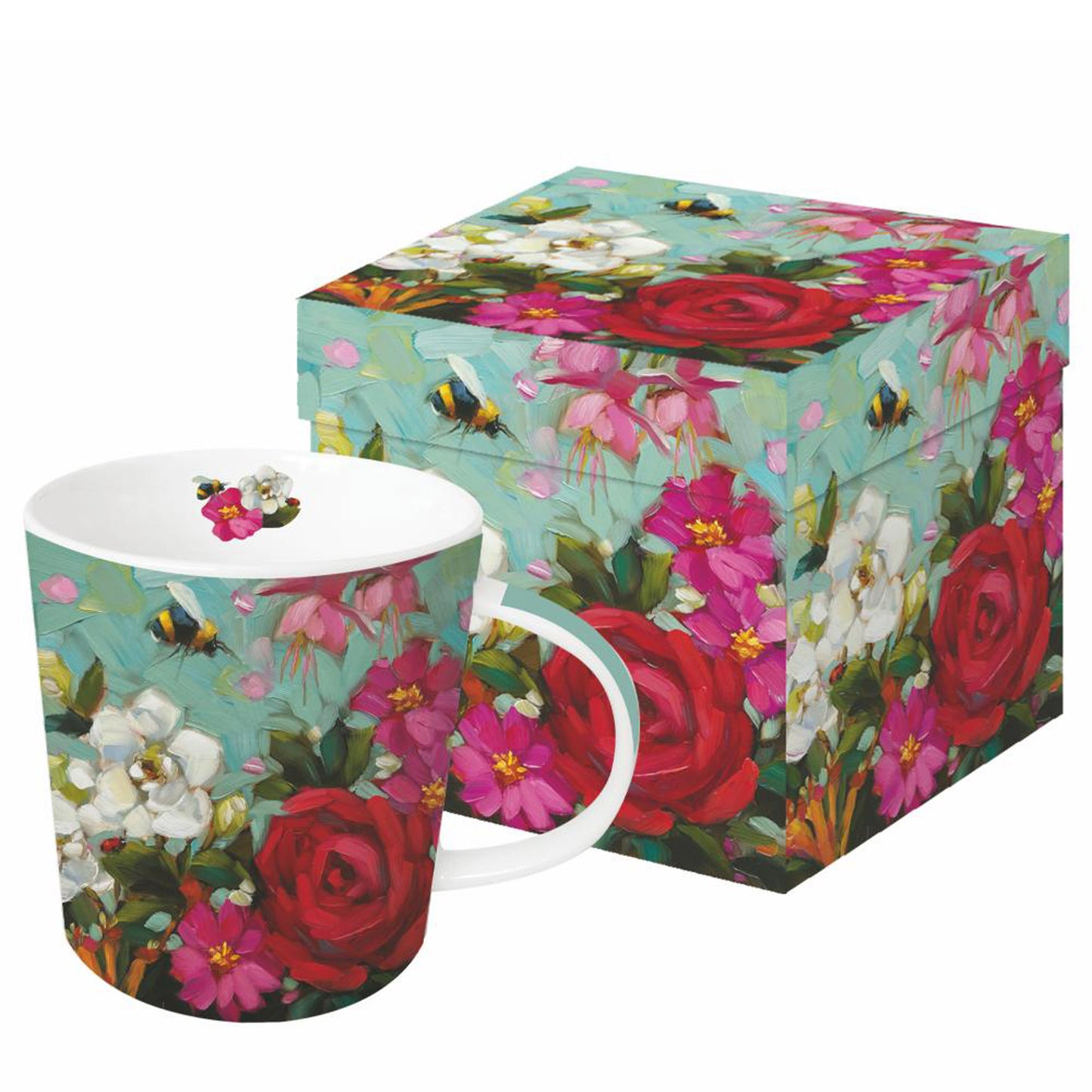 Eine Porzellantasse mit Blumen- und Bienenmotiv steht neben der passenden Geschenkdose.