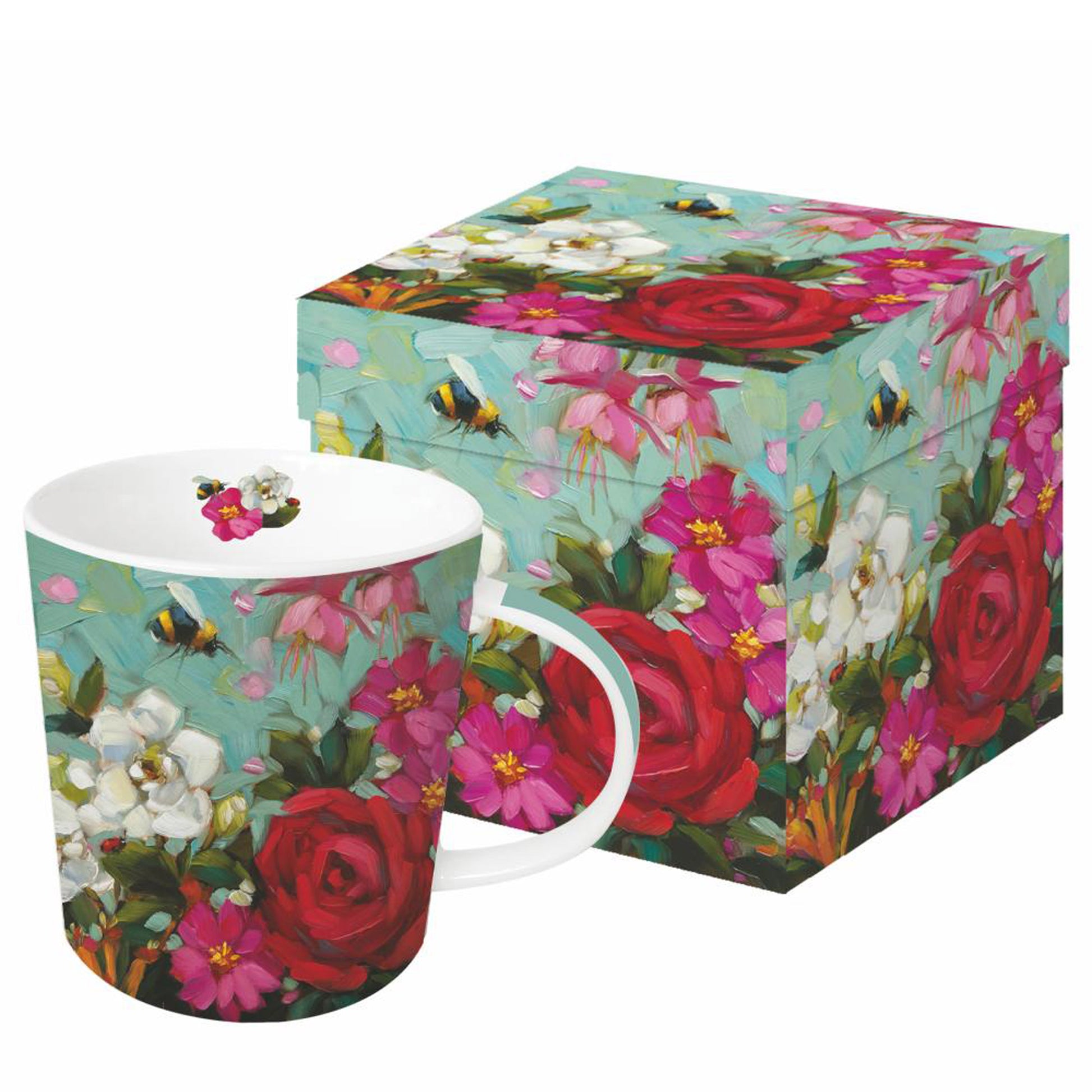 Eine Porzellantasse mit Blumen- und Bienenmotiv steht neben der passenden Geschenkdose.