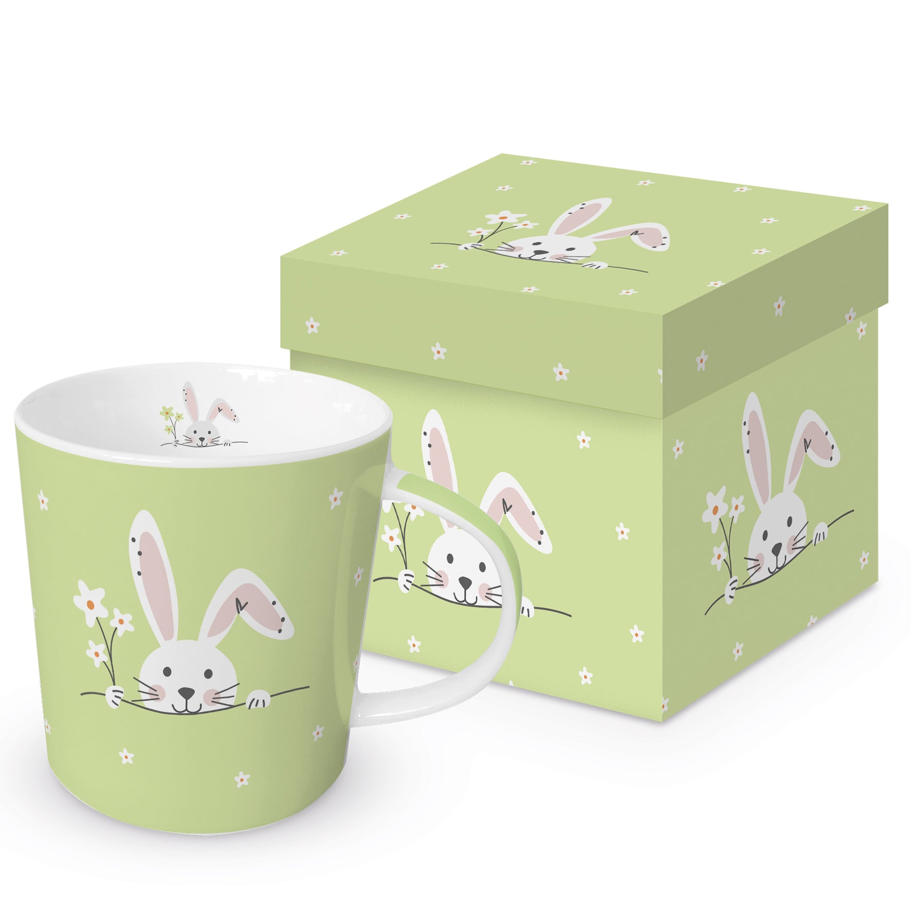 Eine grüne Porzellantasse mit Osterhasen-Motiv und passender Geschenkdose.