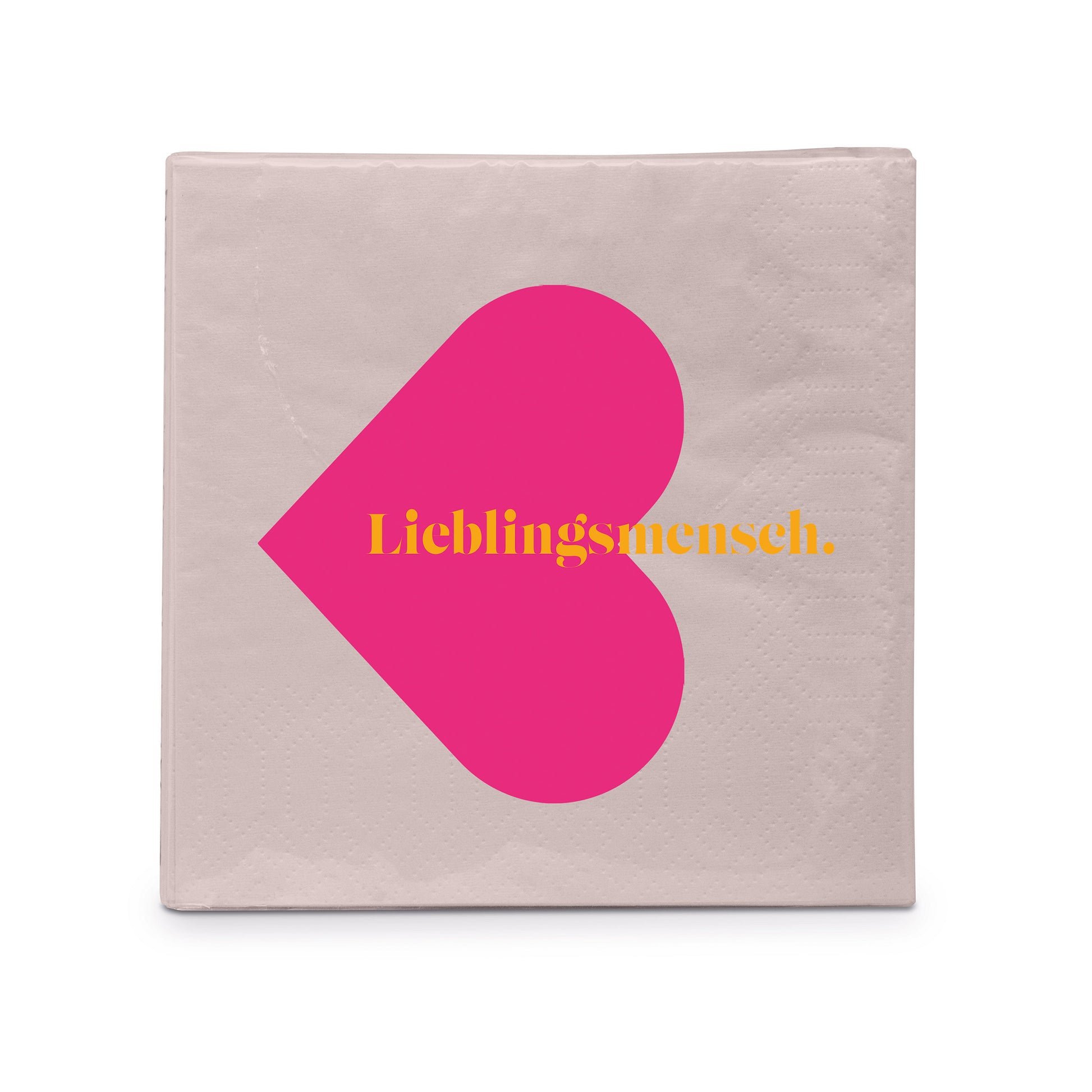 Eine hellgraue Papierserviette mit einem großen pinken Herz und dem gelben Schriftzug Lieblingsmensch.