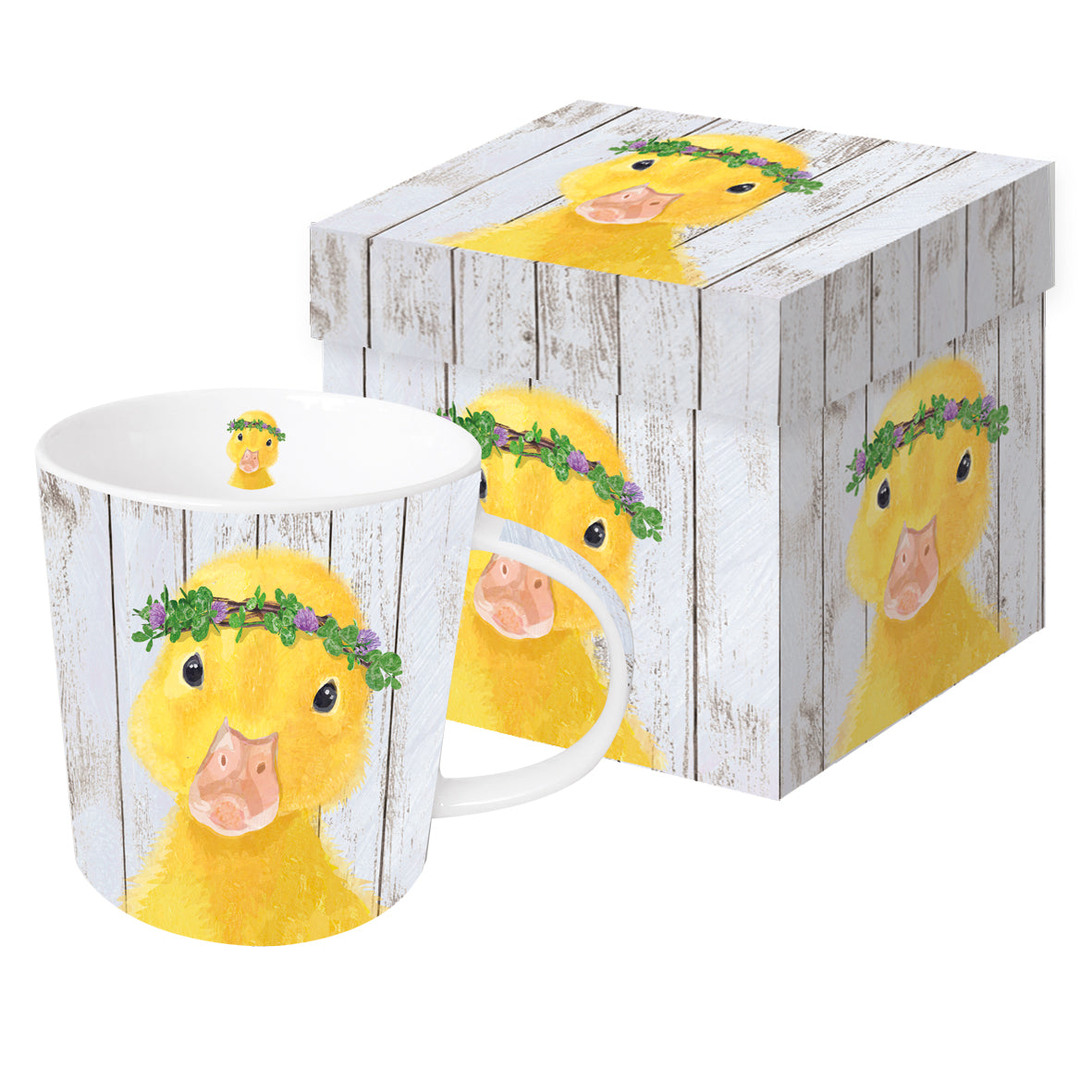 Eine Porzellantasse mit Entenmotiv und Blumenkranz in einer passenden Geschenkdose.